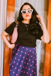 styling black top with 90s midi skirt outfit with cat eye and baguette bag